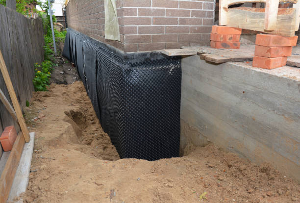 Happy homeowners after waterproofing job in Niles